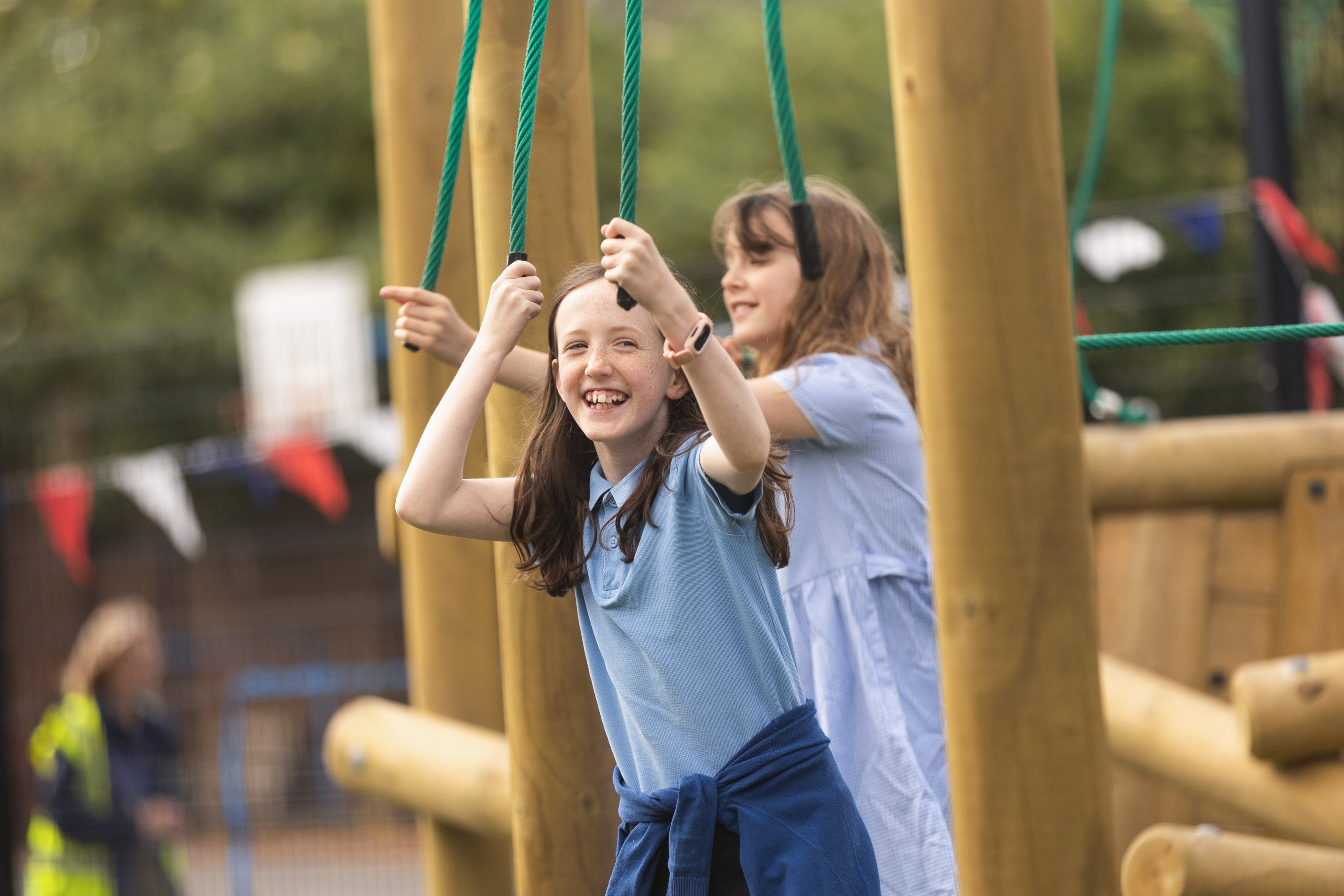 Happy child playing on obstacle course
