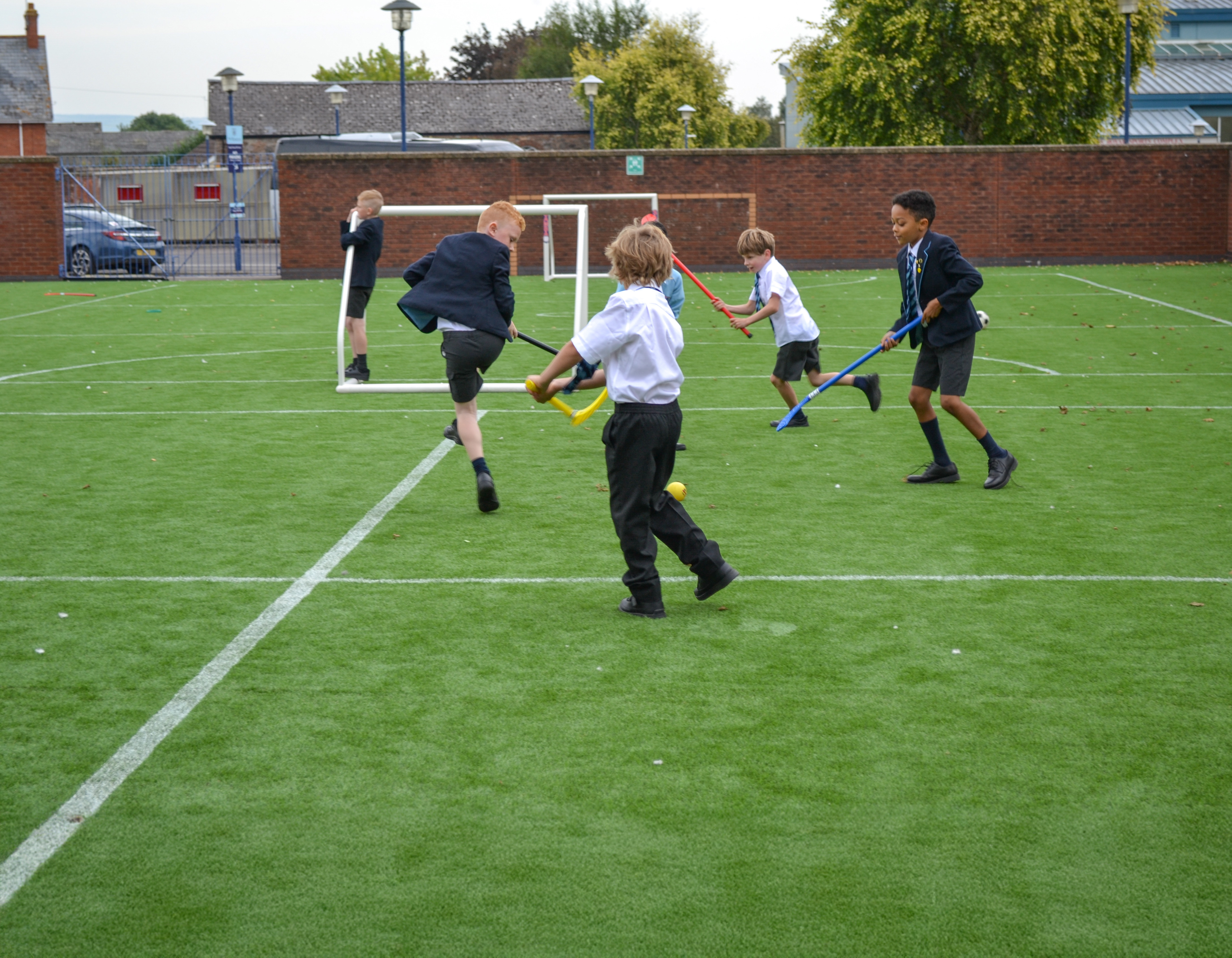 Children playing Hockey outside