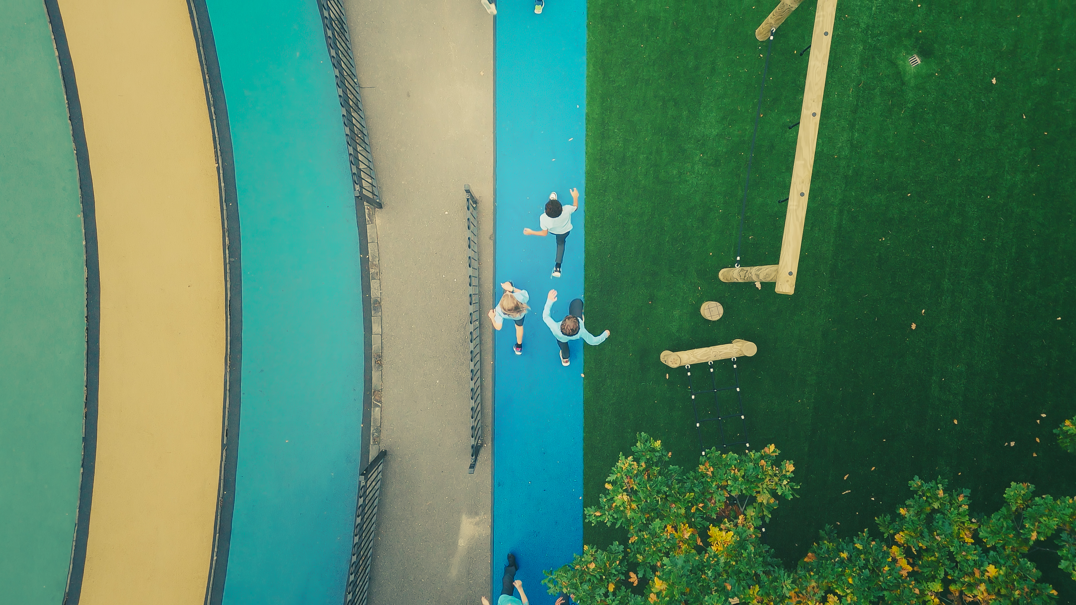 Children running on track