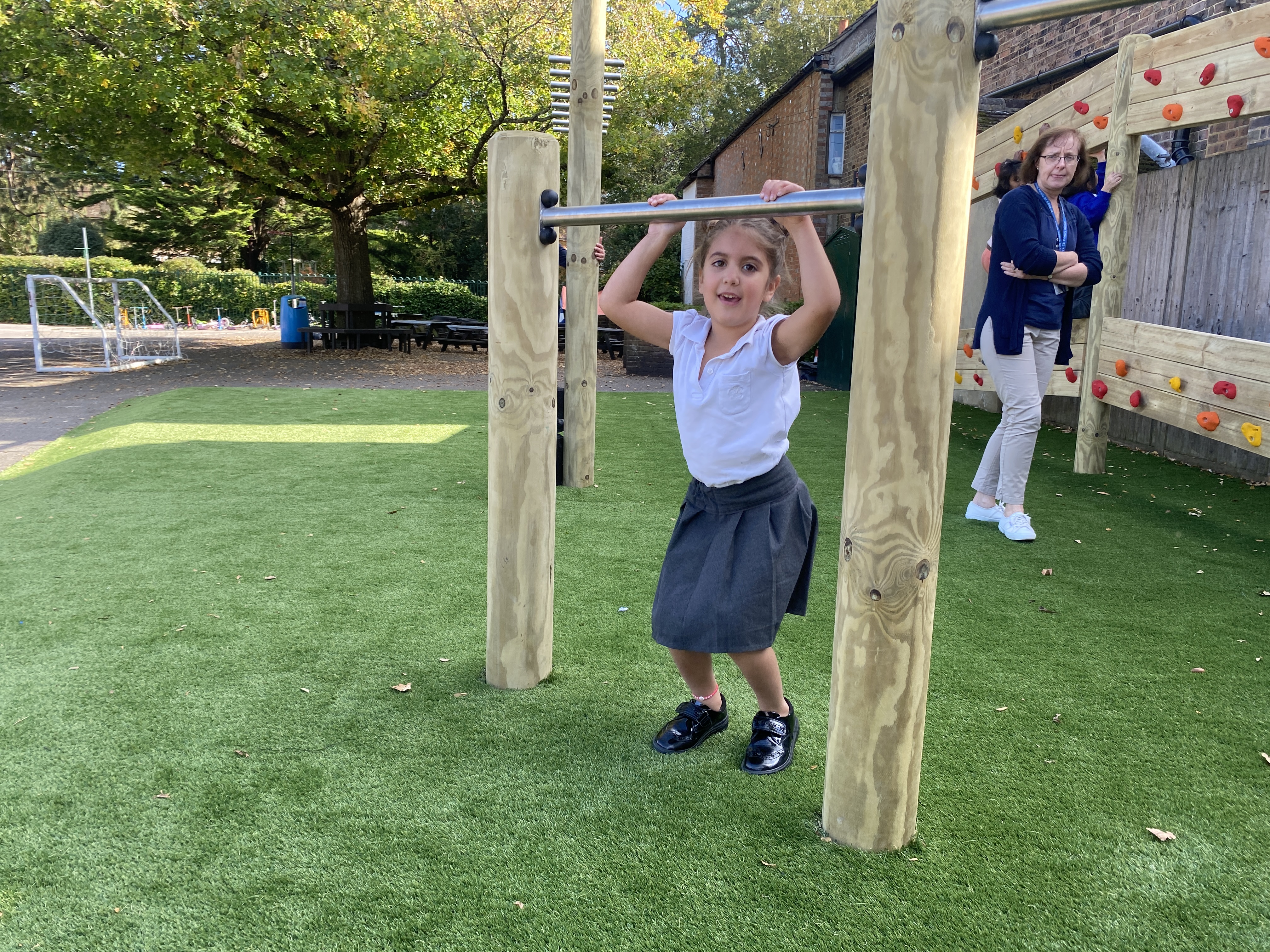 Child playing on roll over bars