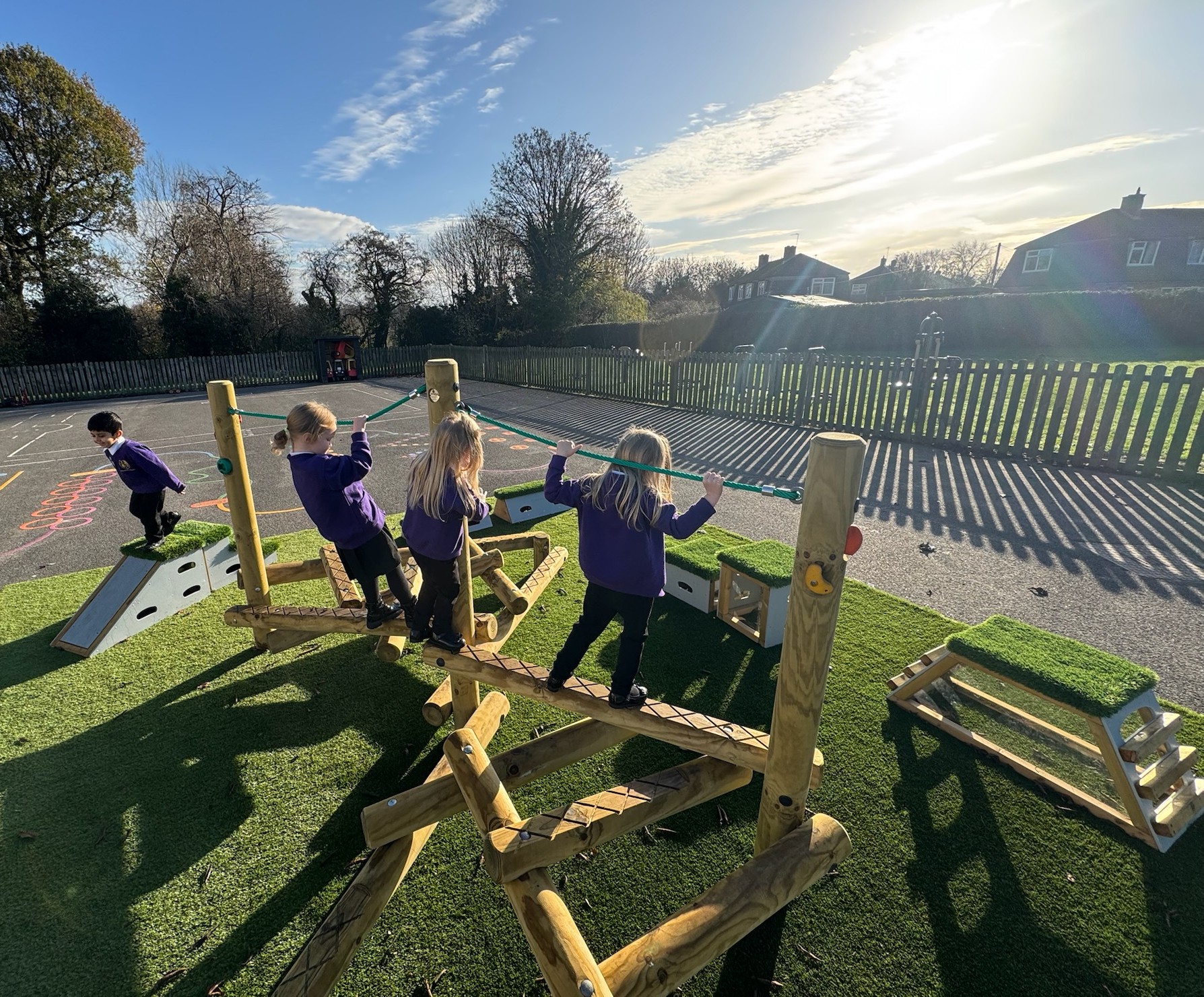 Children enjoying playtime on new equipment