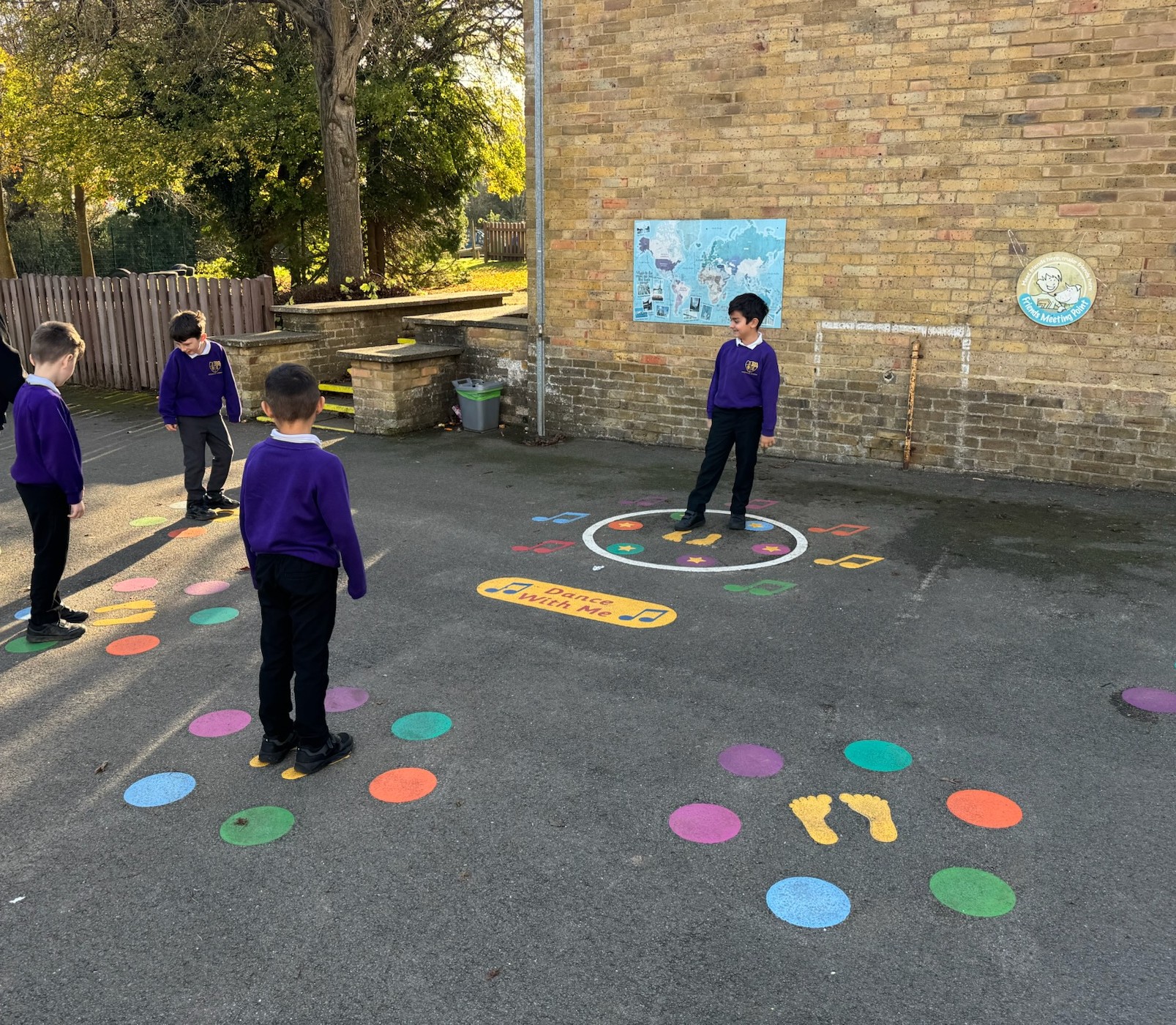 Children playing with playground markings