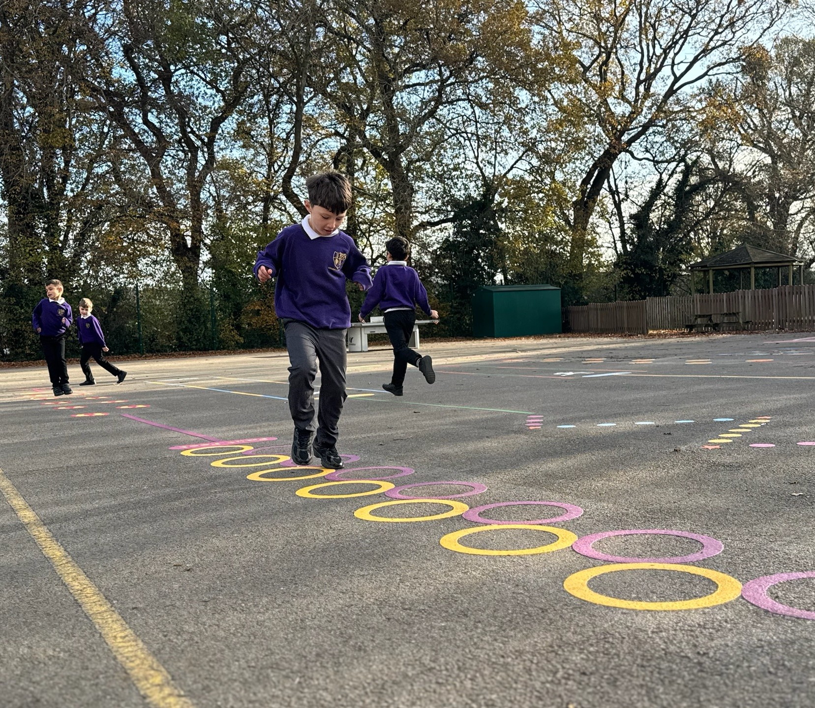 Child playing with playground markings