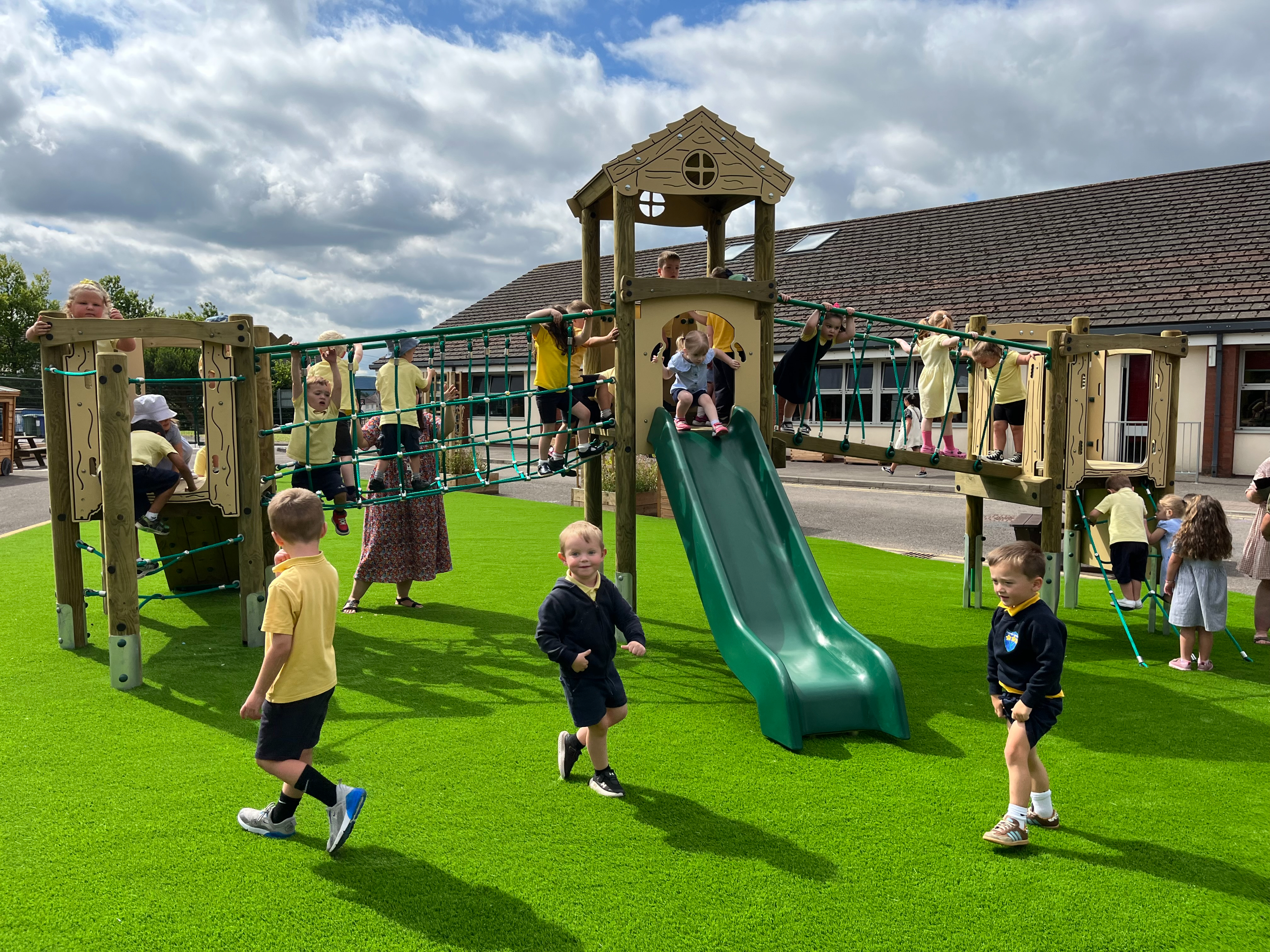 Children playing at Twynyrodyn School on a play tower