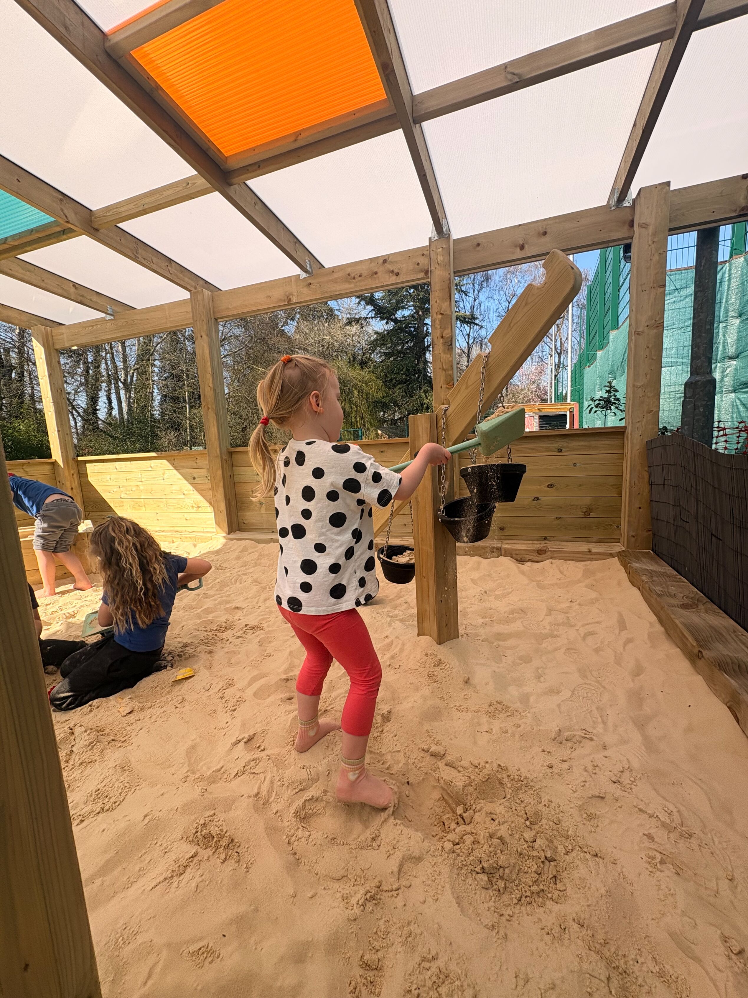 Canopy with Coloured Roof Panels covering Sand Play environment: Orton Longueville Playgroup
